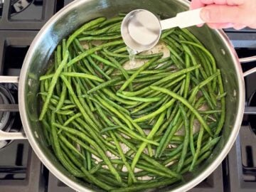 Adding water to the skillet.