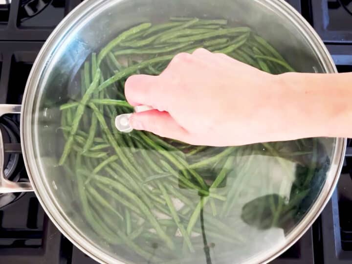 Cover the skillet with a lid.