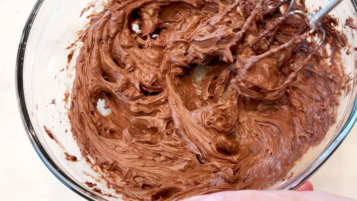 Mixing the frosting for the cupcakes.