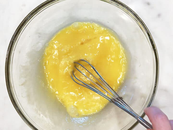 Mixing the wet ingredients in a bowl.