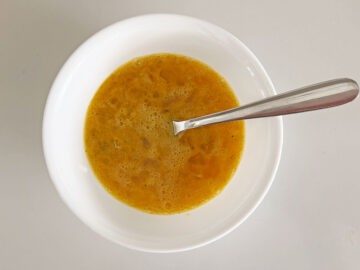 Egg and spice mixture in a white bowl.