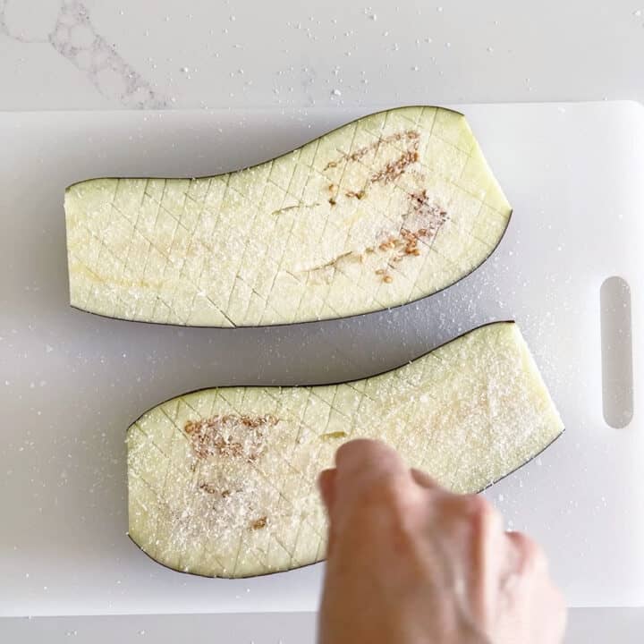 Salting the eggplant.