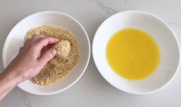 Dredging a scallop in parmesan.