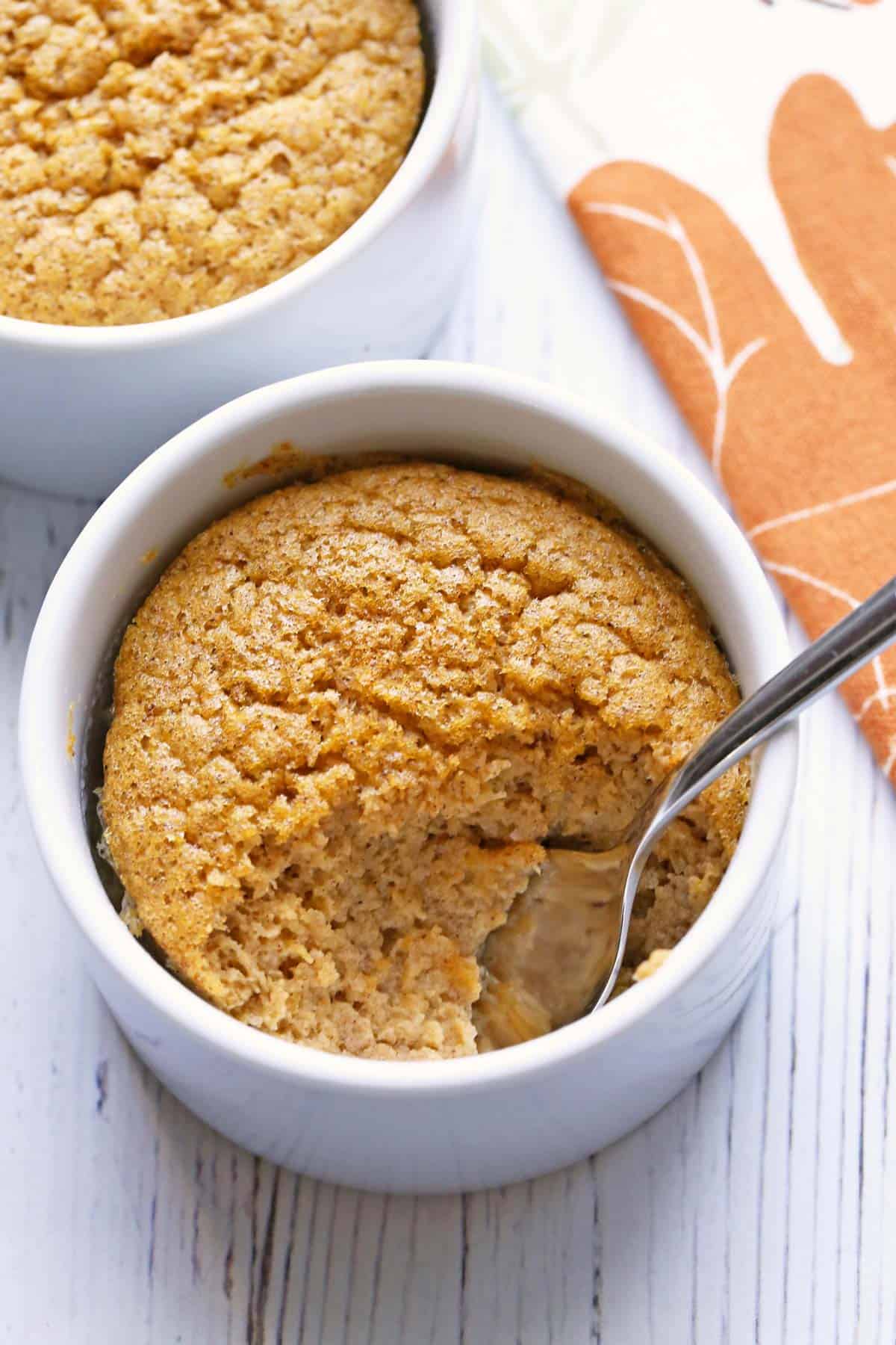 A butternut squash souffle is served in ramekins.