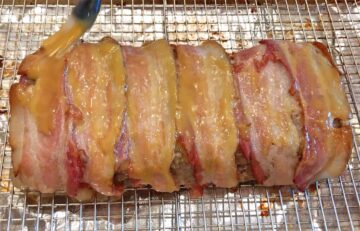 Glazing the meatloaf.