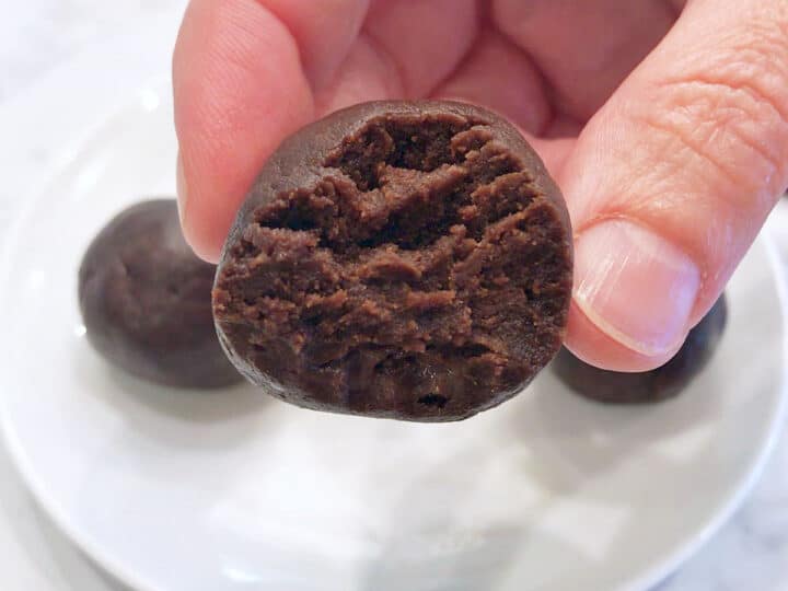 A bitten keto fat bombs shows its soft texture.