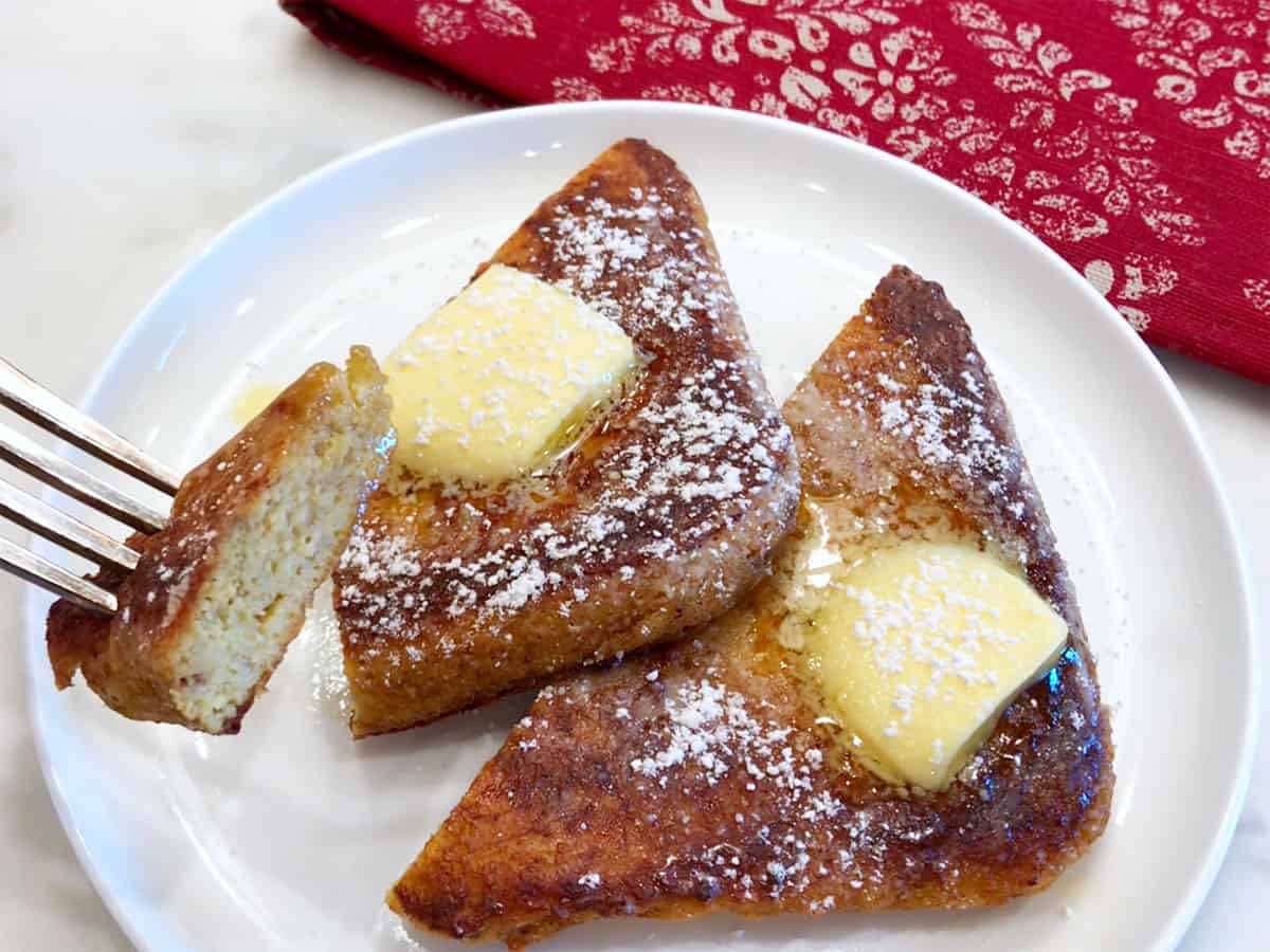 Cutting keto French toast to show its texture.