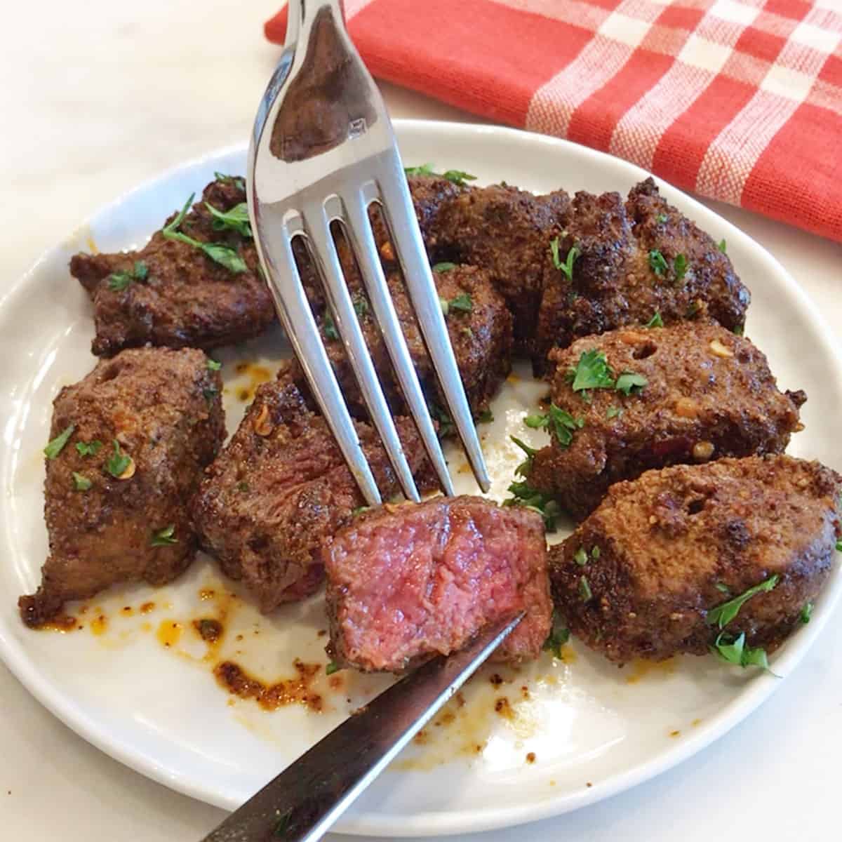 Medium rare beef kabobs.