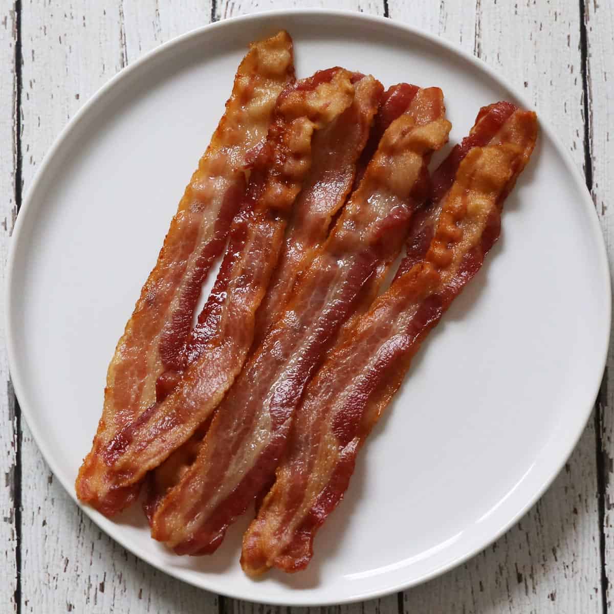 Bacon baked for 20 minutes in a 425°F oven.