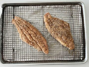 Placing the fish in the pan.