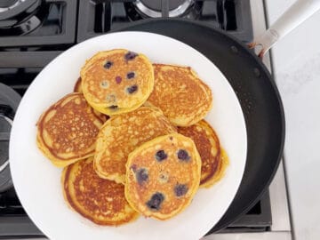 Transferring the pancakes to a plate.