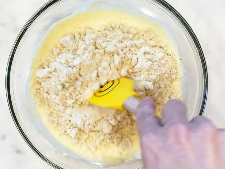 Adding the dry ingredients to the bowl.