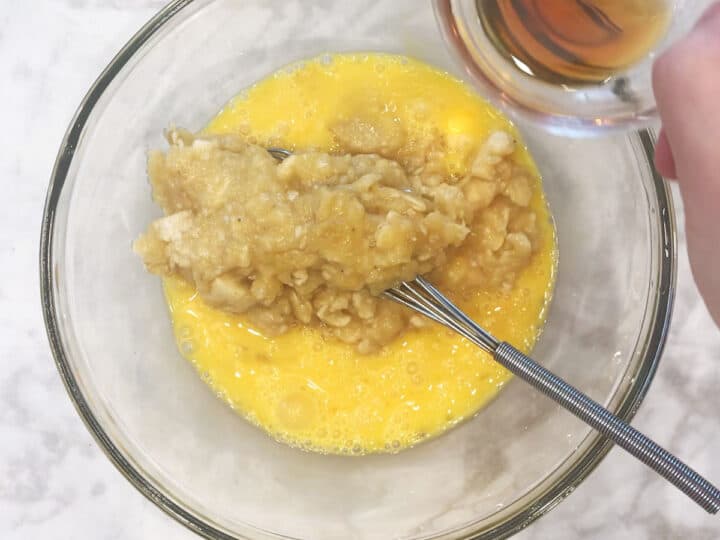 Mixing the bread's wet ingredients in a bowl.