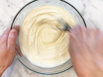 Mixing the frozen yogurt ingredients in a bowl.