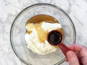 Adding frozen yogurt ingredients in a bowl.