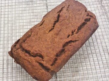 The bread is cooling on a wire rack.