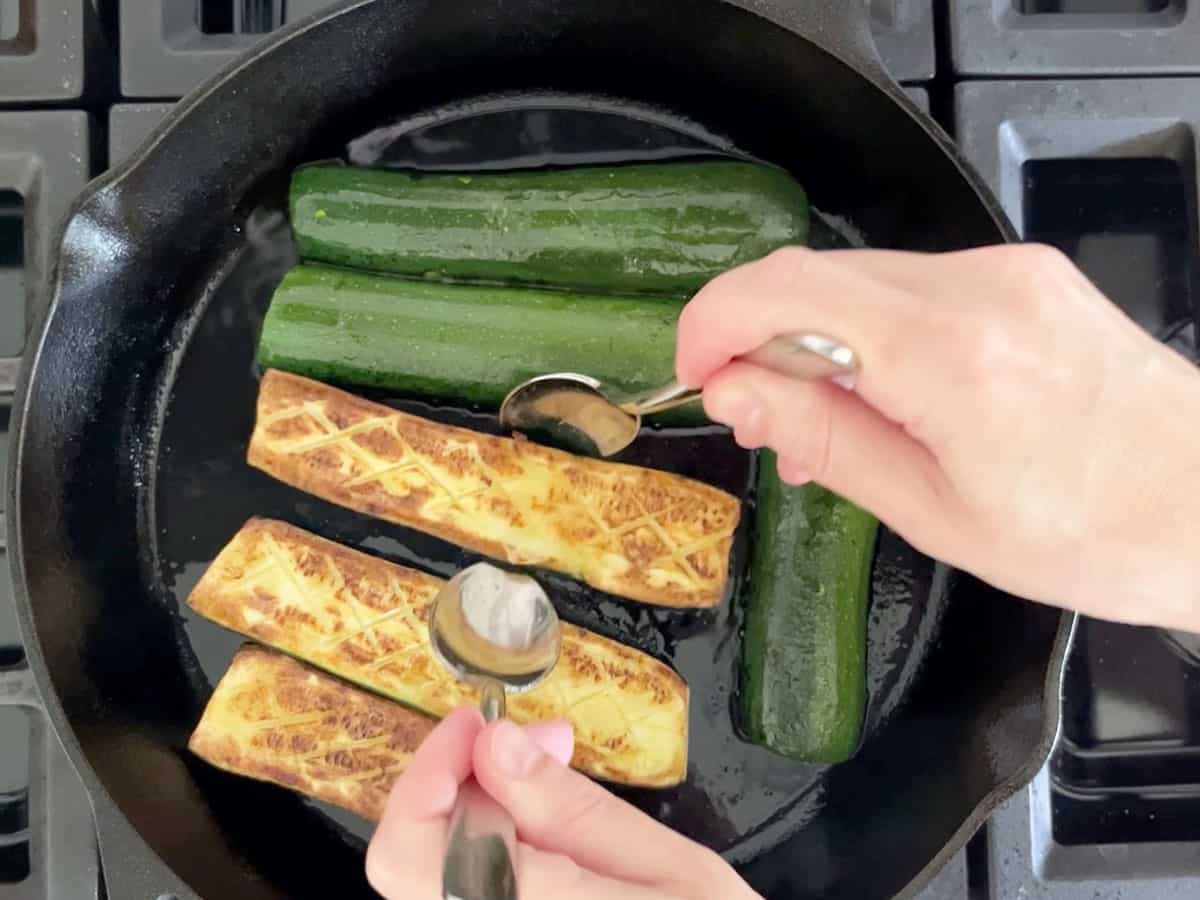 Flipping the zucchini.