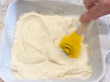 Stirring the frozen yogurt in the pan.