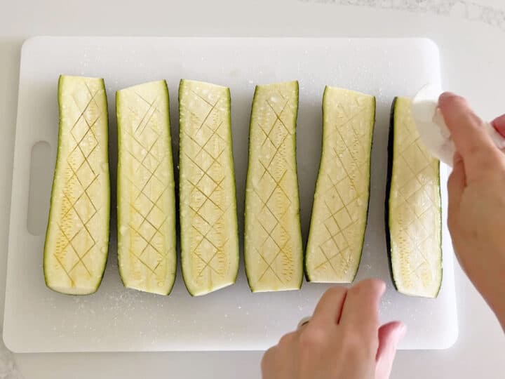 Wiping the water off the zucchini.