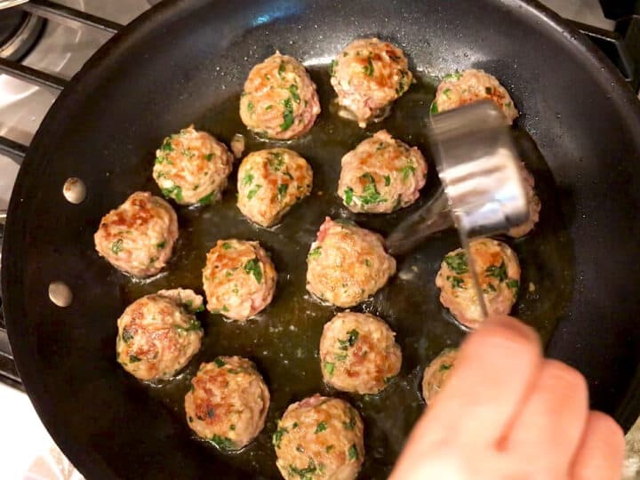 Adding water to the skillet.