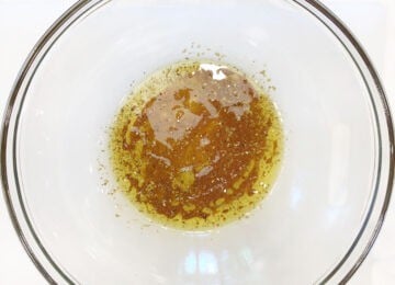 The marinade for veggie kabobs was mixed in a bowl.