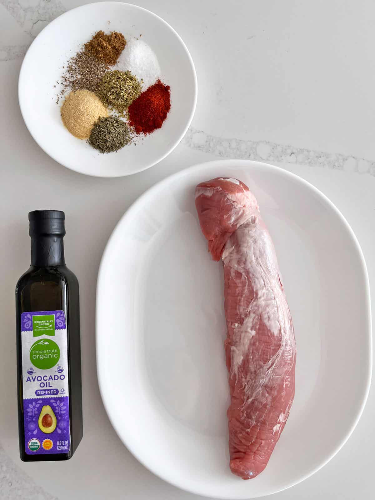 The ingredients needed to roast a pork tenderloin.