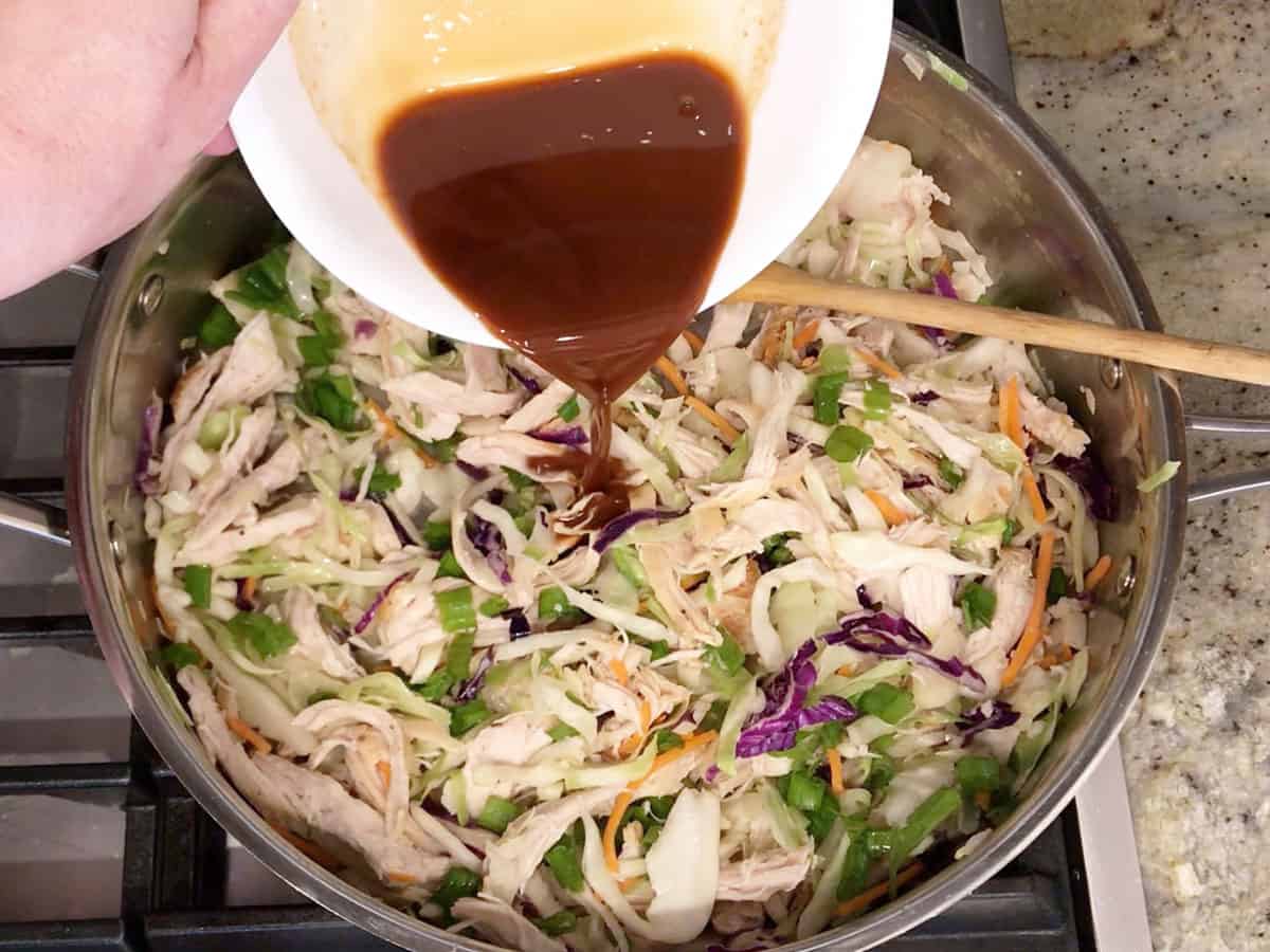 Adding the scallions and sauce.