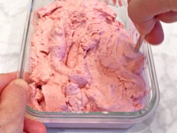 Stirring the ice cream.