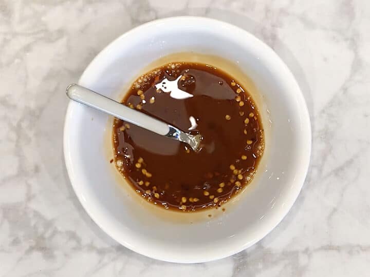 Mixing the sauce in a bowl.