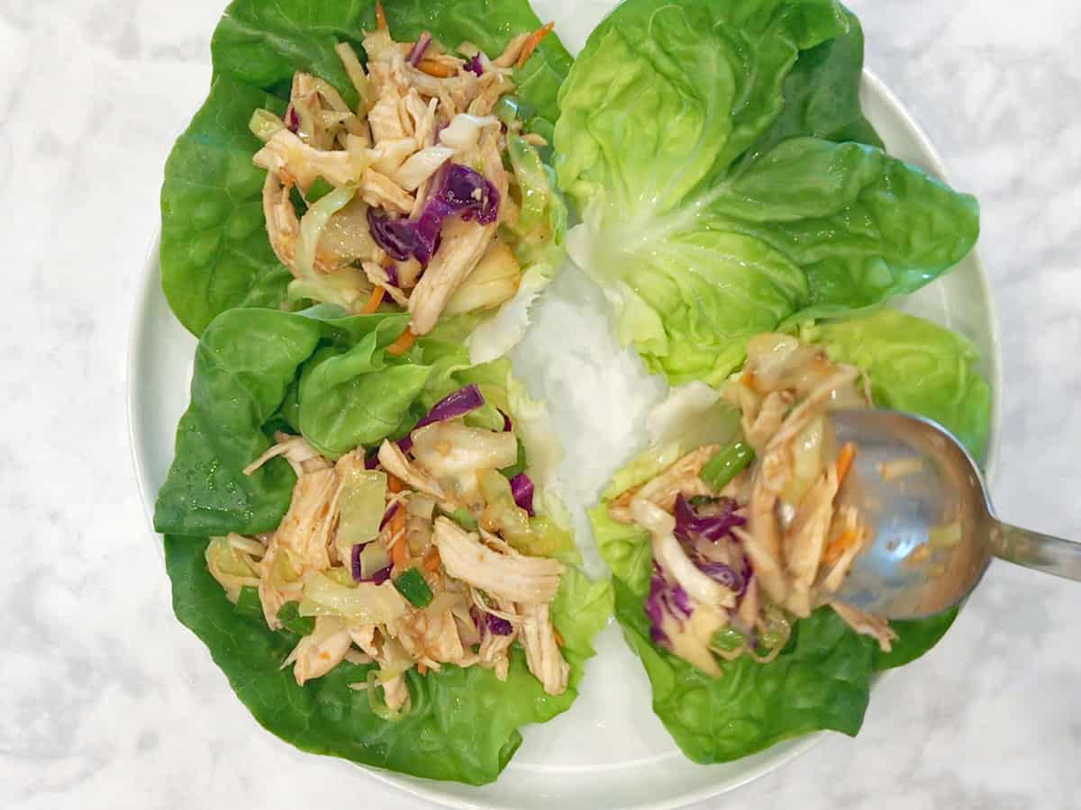 Serving moo shu chicken in lettuce cups.