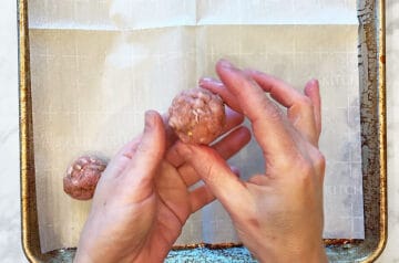 Shaping the meatballs.