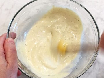 Mixing the dressing.