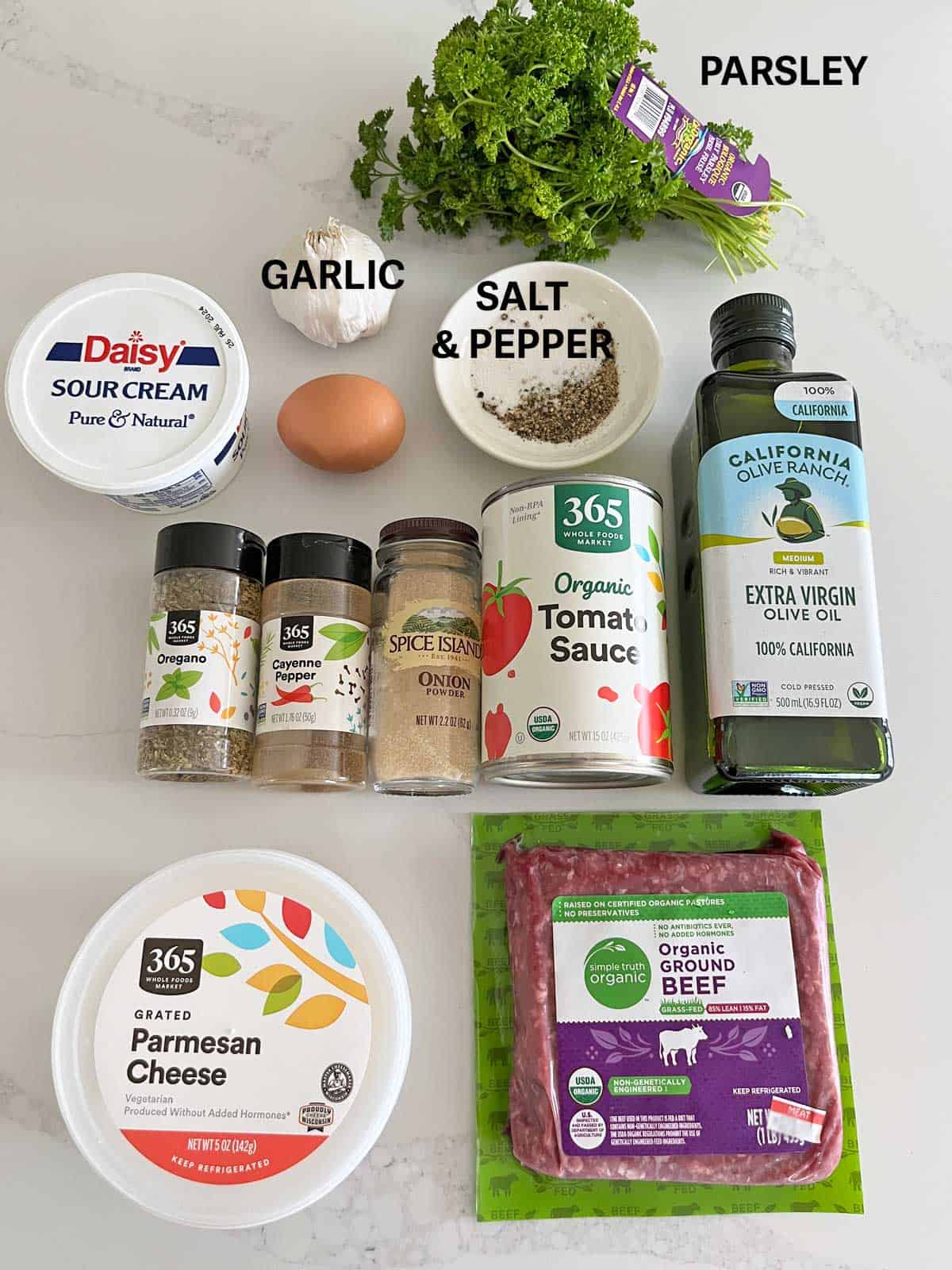 The ingredients needed to make meatballs in tomato sauce.