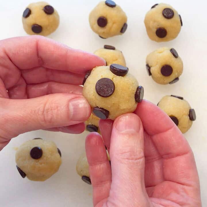 Adding chocolate chips.