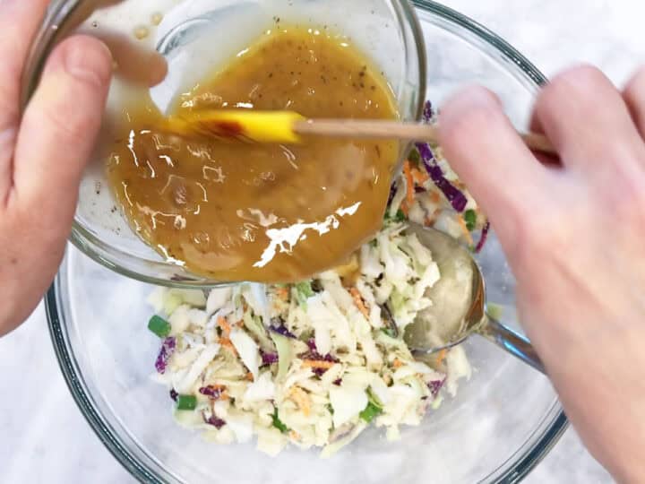 Adding the egg mixture to the cabbage mixture.