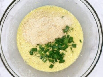 Adding parmesan and scallions.