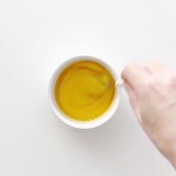 Adding stevia, vanilla, and an egg.