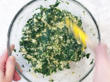 Mixing in flour and cheese.