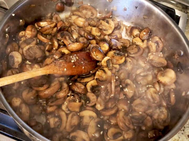 Adding garlic and spices.