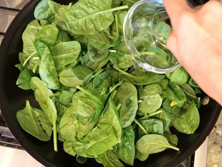 Adding water to the saucepan.