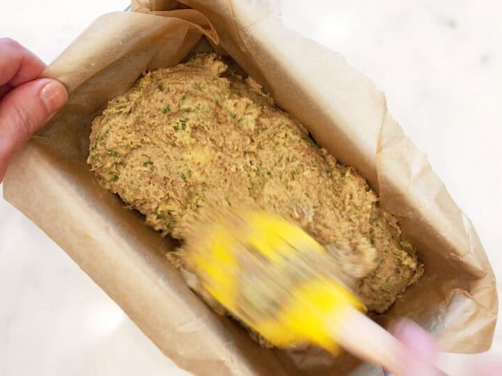 Spreading the batter in the pan.