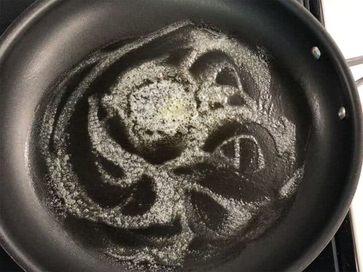 Butter foaming in a skillet.