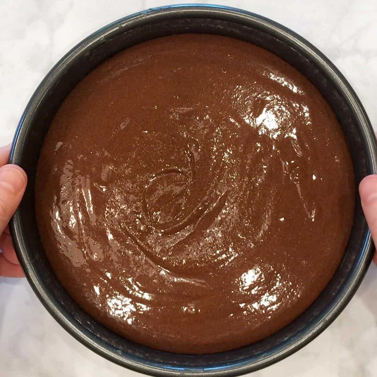 The cake batter is in the pan and ready for the oven.
