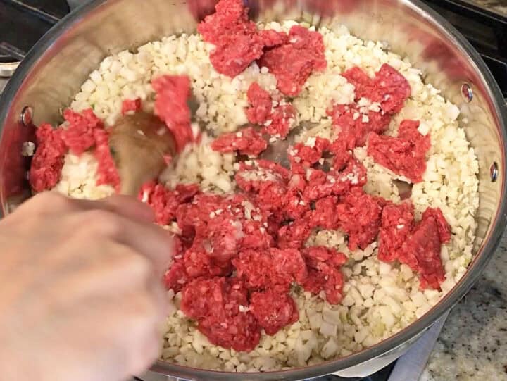 Cooking ground beef and cauliflower.
