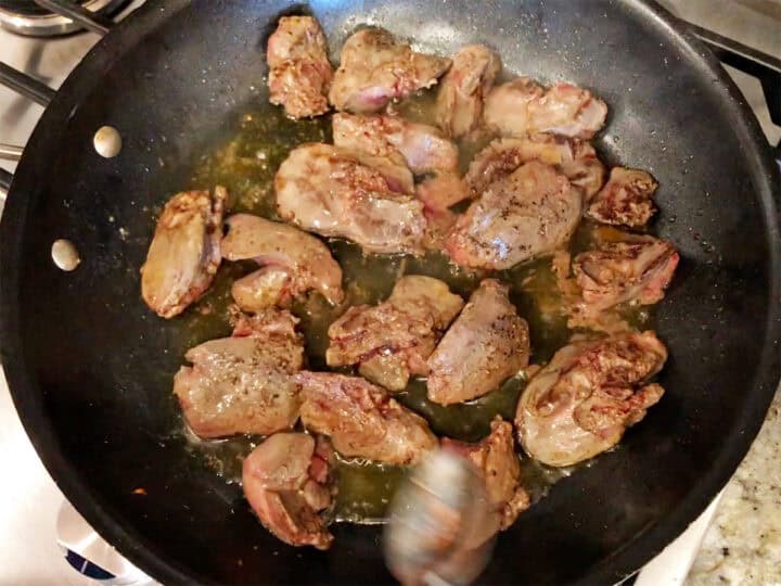 Continuing to cook the livers.