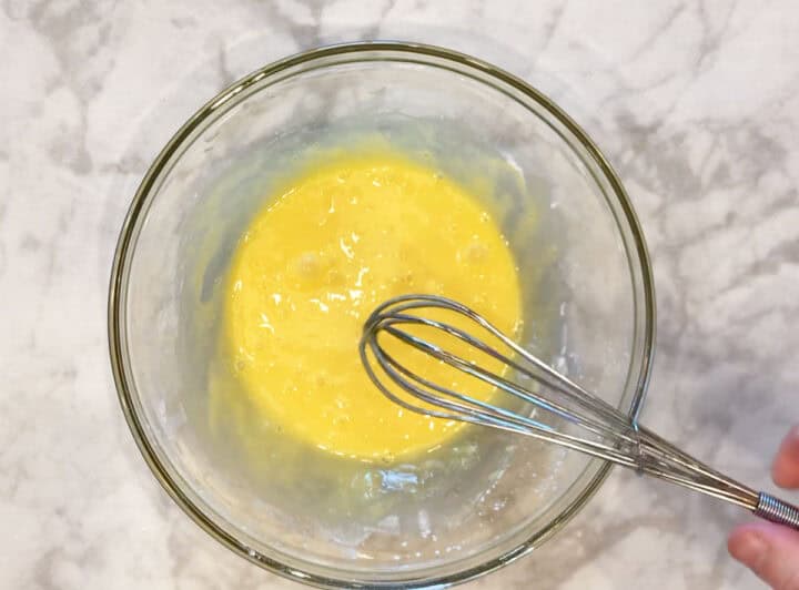 Mixing the egg and sweetener.