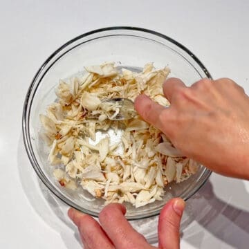 Flaking the crabmeat.