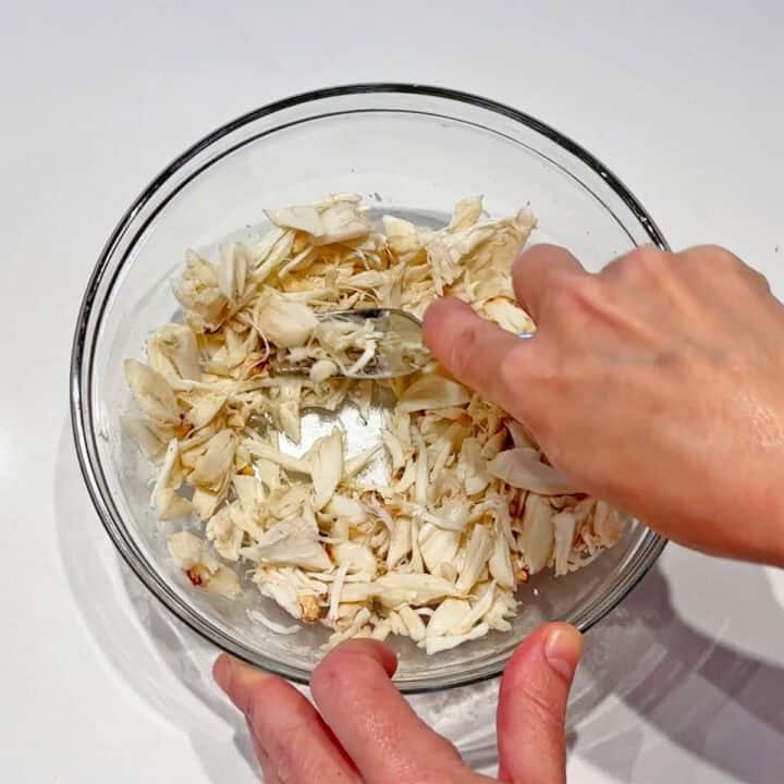 Flaking the crabmeat.