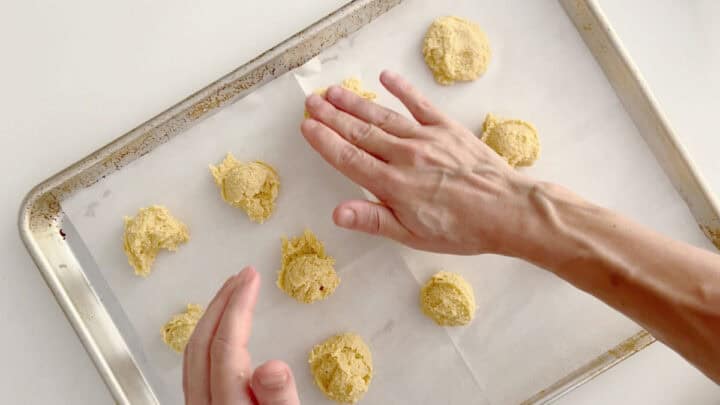Flattening the cookies.