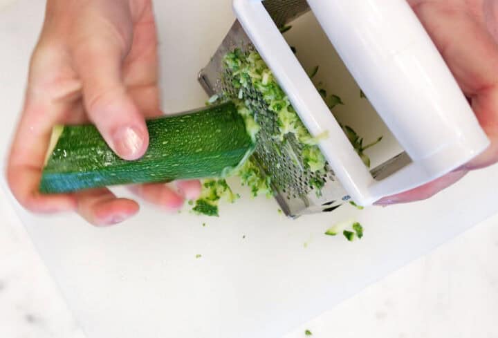 Grating zucchini.